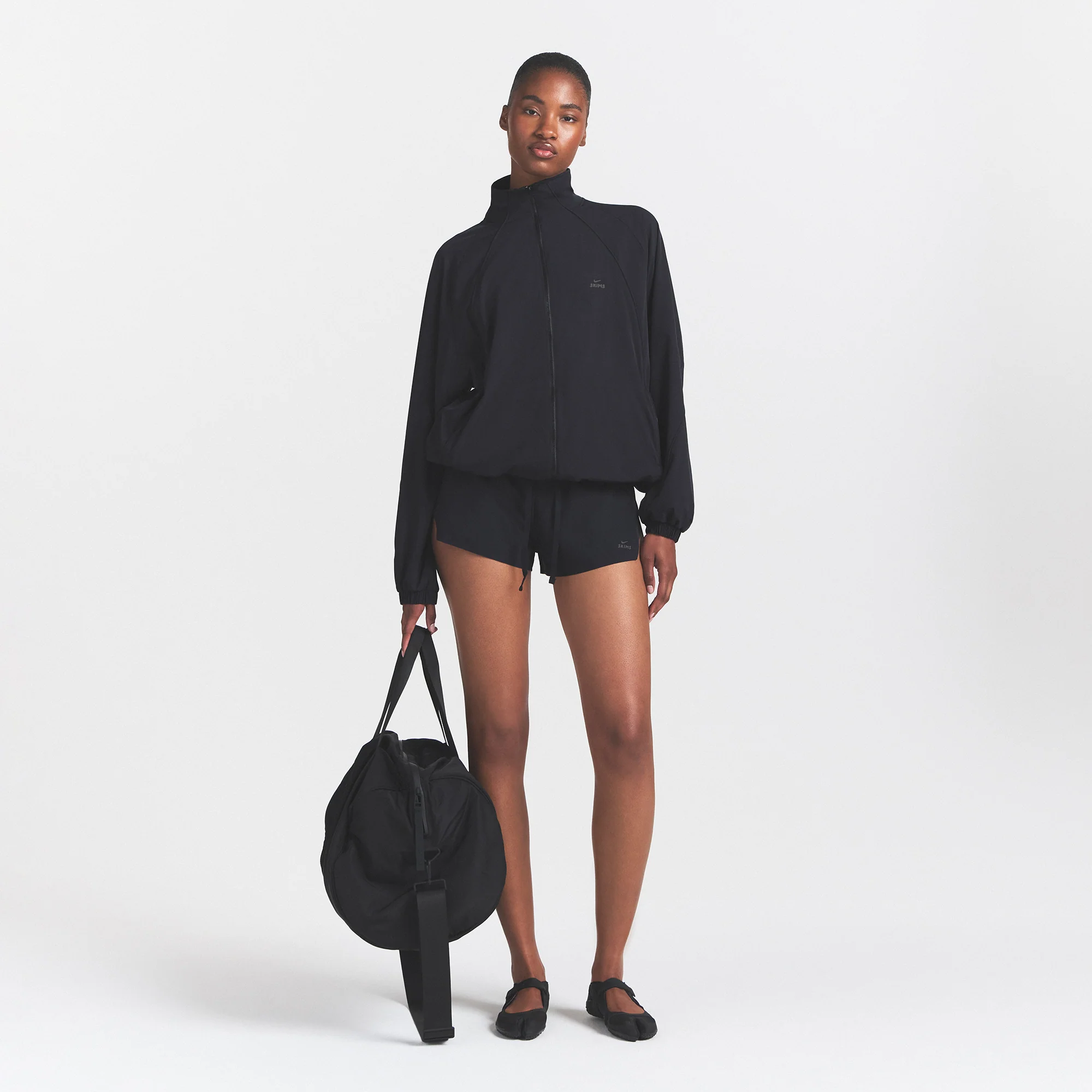 NikeSKIMS STRETCH NYLON OVERSIZED TRACK JACKET | OBSIDIAN - Image 2