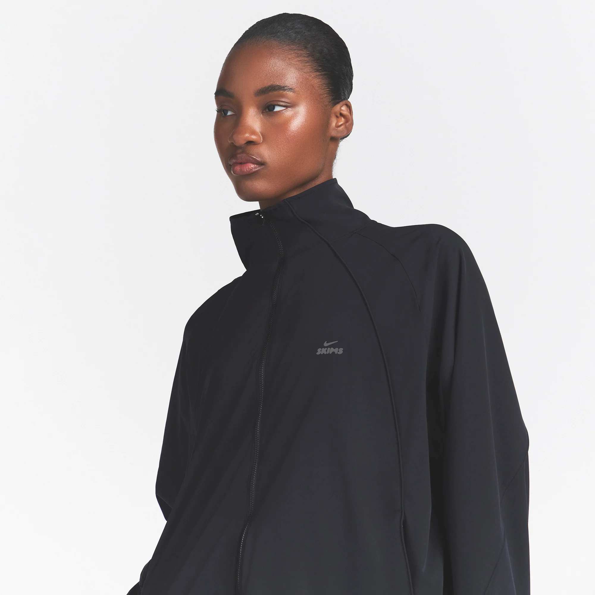 NikeSKIMS STRETCH NYLON OVERSIZED TRACK JACKET | OBSIDIAN - Image 4