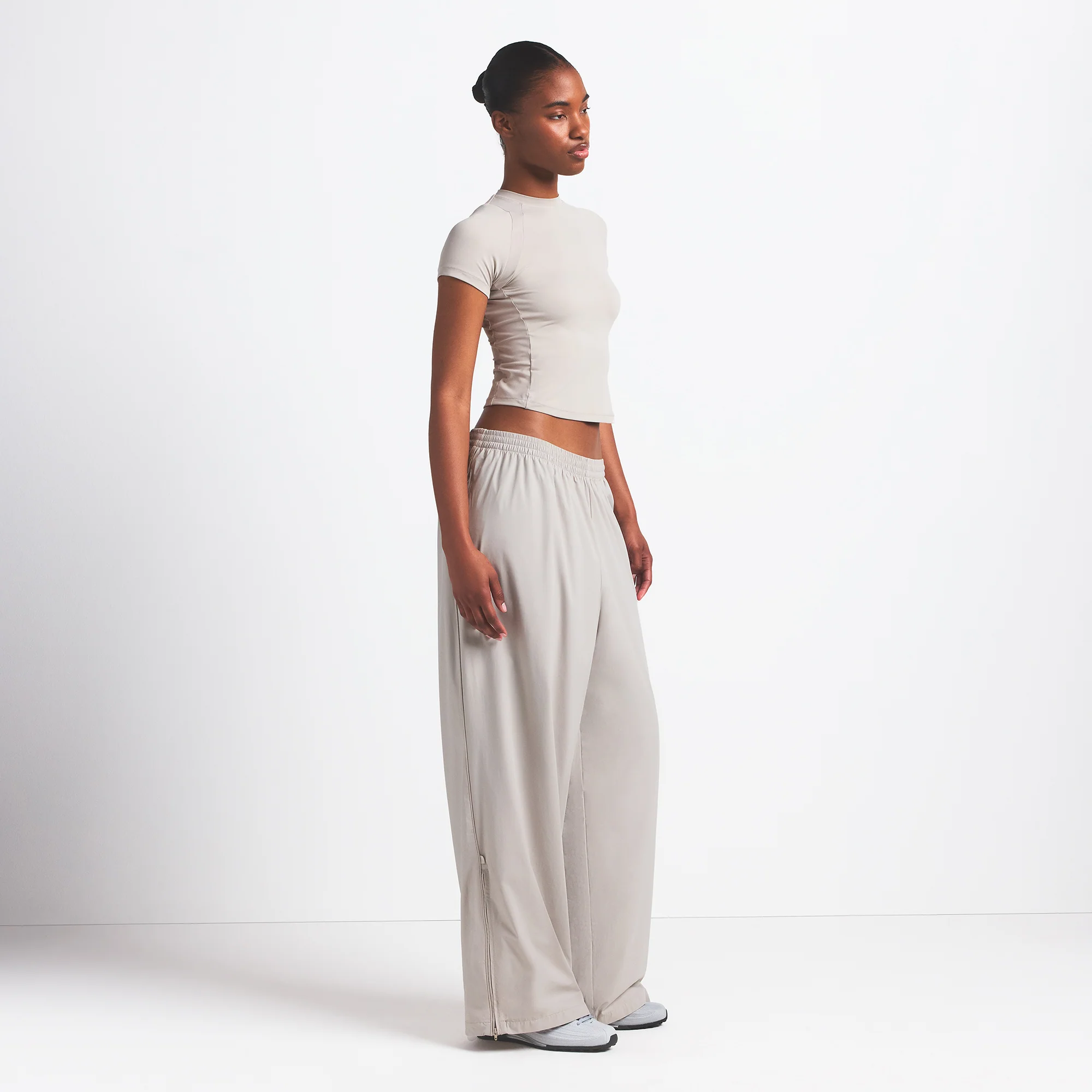 NikeSKIMS WOVEN NYLON OVERSIZED TRACK PANT | STONE - Image 3