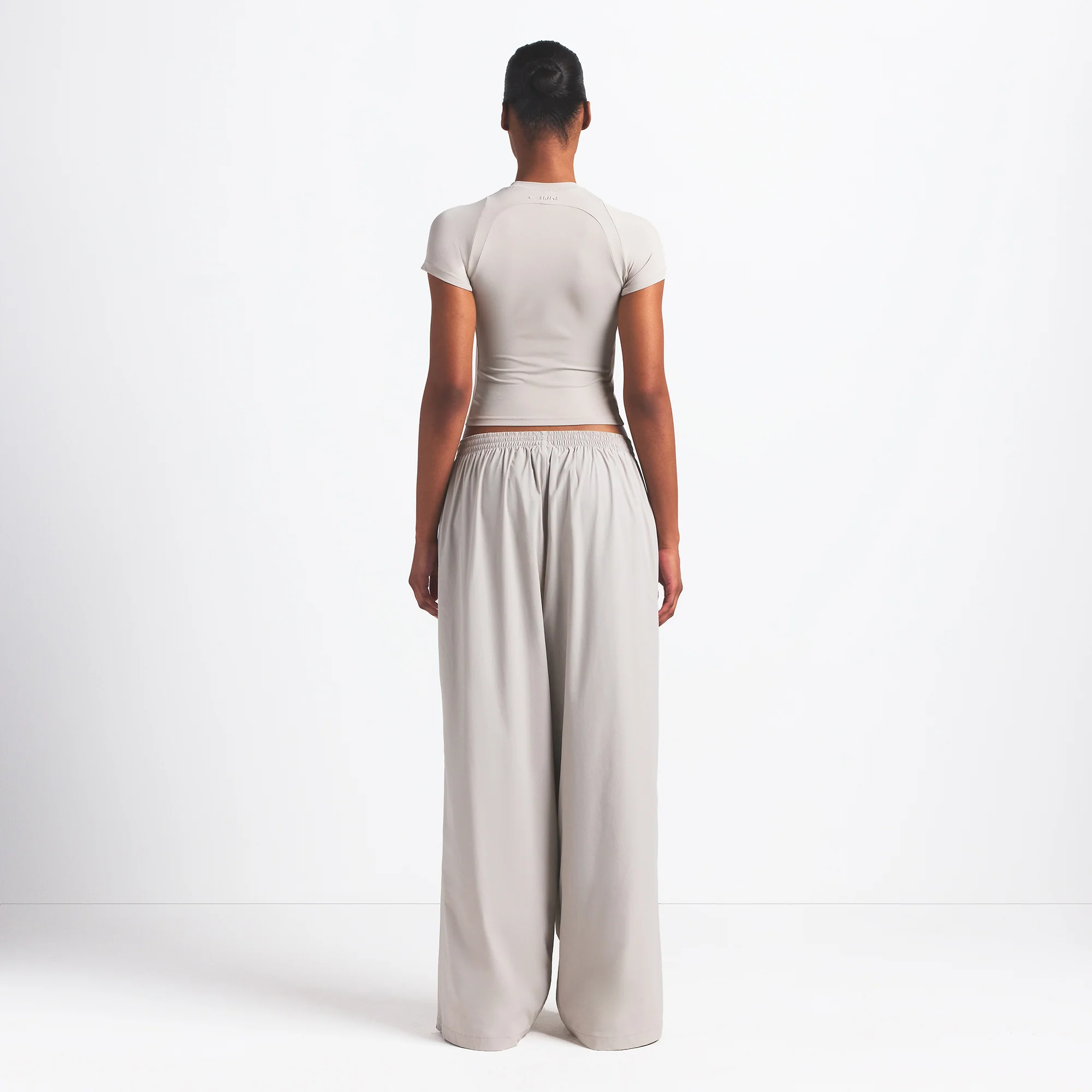 NikeSKIMS WOVEN NYLON OVERSIZED TRACK PANT | STONE - Image 5